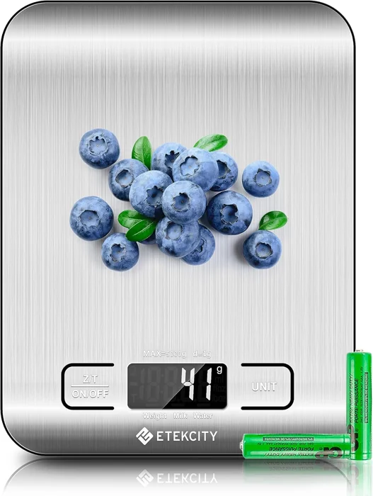 Etekcity EK6015 stainless steel digital food scale with blueberries on the platform and two AAA batteries